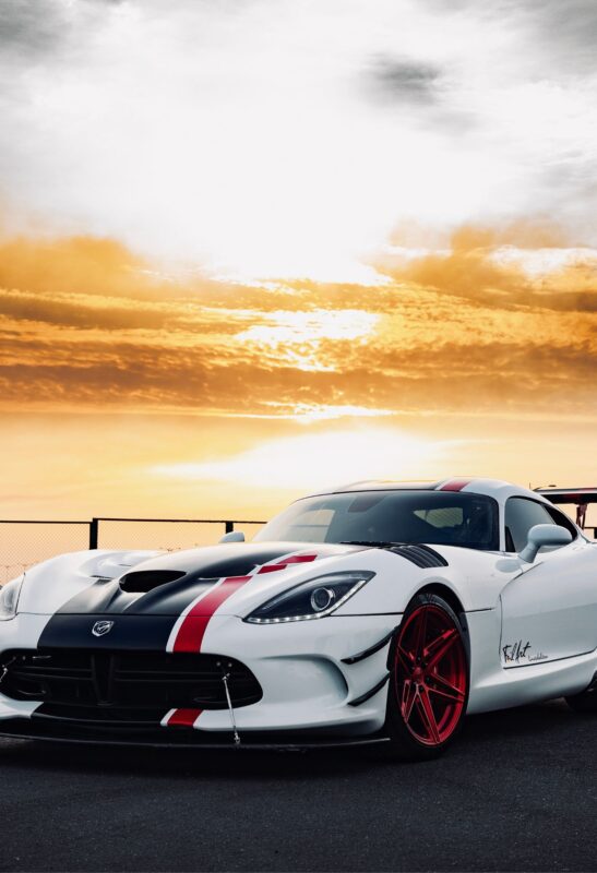 white sports car metal poster