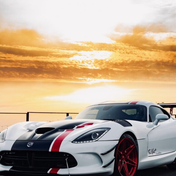 white sports car metal poster